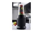 Black blender with a clear cup filled with various fruits, 1000 Watts, in a kitchen.