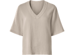 Bézs színű, V-nyakú, rövid ujjú női blúz, muszlin anyagból.