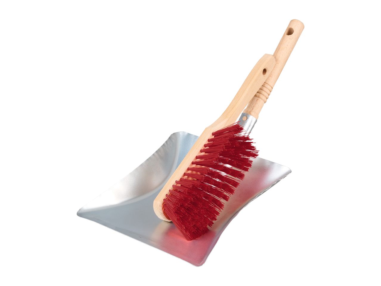 A red brush with a wooden handle resting on a silver dustpan.
