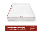 A white electric blanket measuring 120 cm x 135 cm on a mattress.