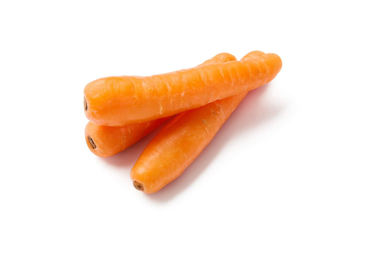 Three fresh carrots on a white background.