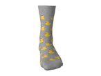Grey sock with a pattern of yellow rubber ducks wearing Santa hats.