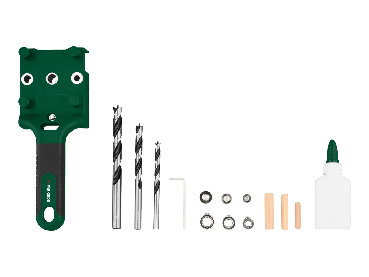 A green drilling jig with three drill bits, an Allen key, metal rings, wooden dowels, and a bottle of glue.