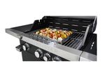 Grillmeister gas grill with meat and vegetable skewers.