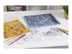 Paw Patrol coloring book, sticker sheet, and pencils on a white table.