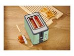 Toaster with toast, jam, and a butter knife on a wooden surface.