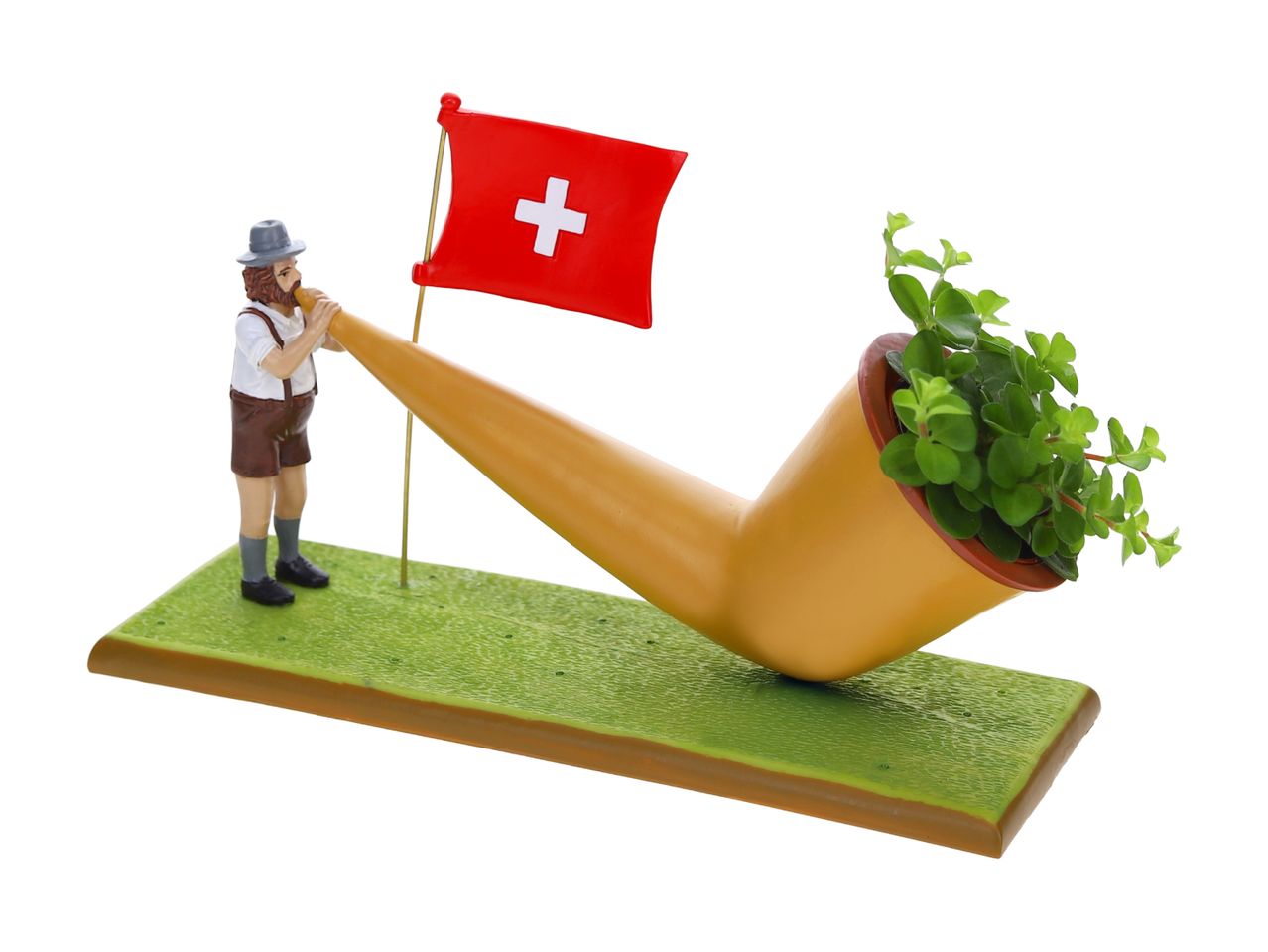 Un alphorne miniature avec un personnage suisse et un drapeau suisse.