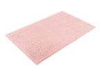 A pink bath mat with a textured surface.