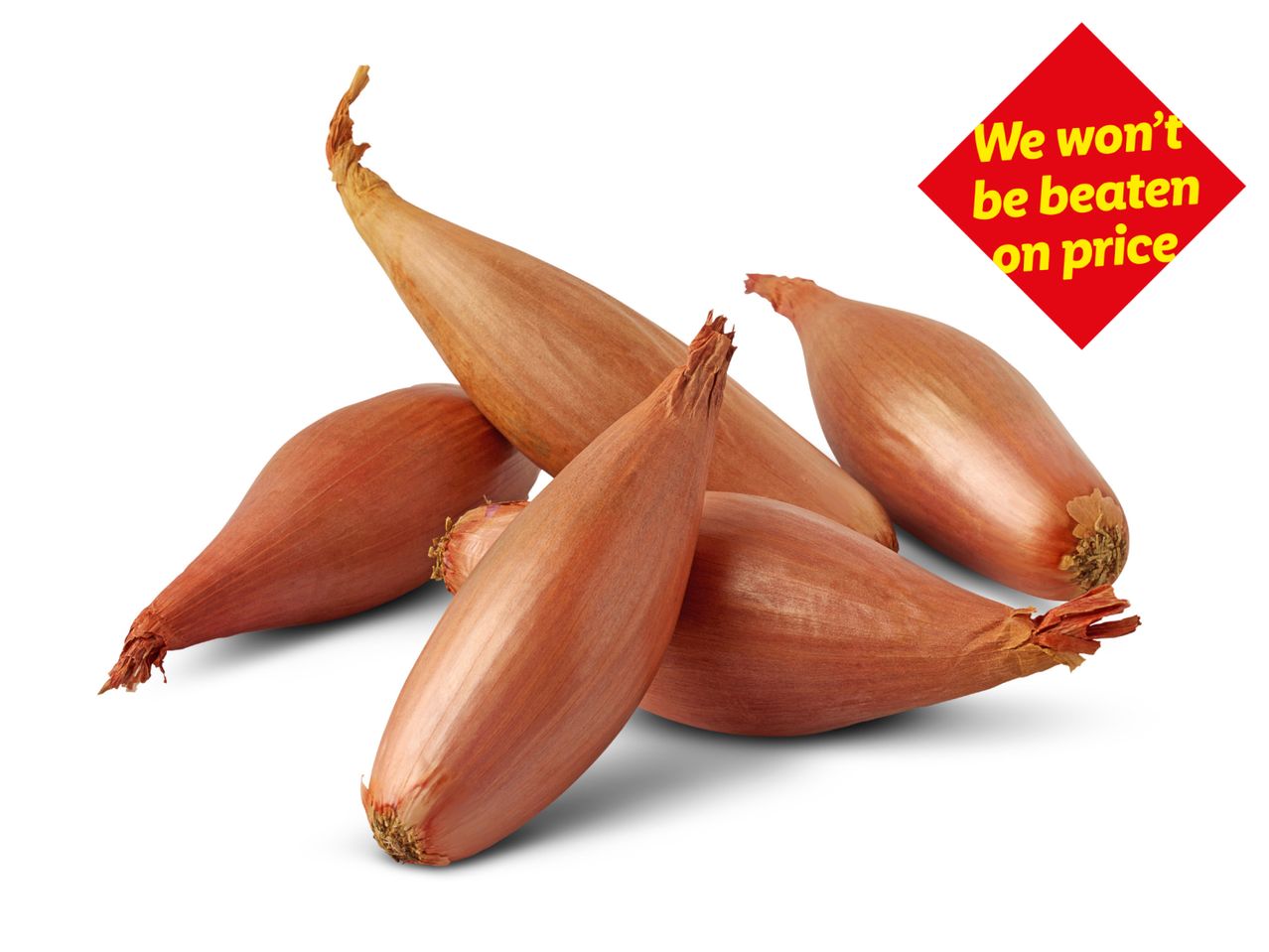 A pile of shallots with a red diamond-shaped sign saying 'We won't be beaten on price'.