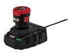 A black and red Parkside battery and charger with a green light indicating charging.