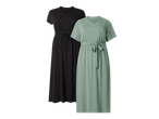 Dvije haljine: crna s V-izrezom i vezicom u struku te zelena s preklopnim izrezom i pojasom.