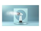 A handheld garment steamer emits steam against a minimalist blue background.