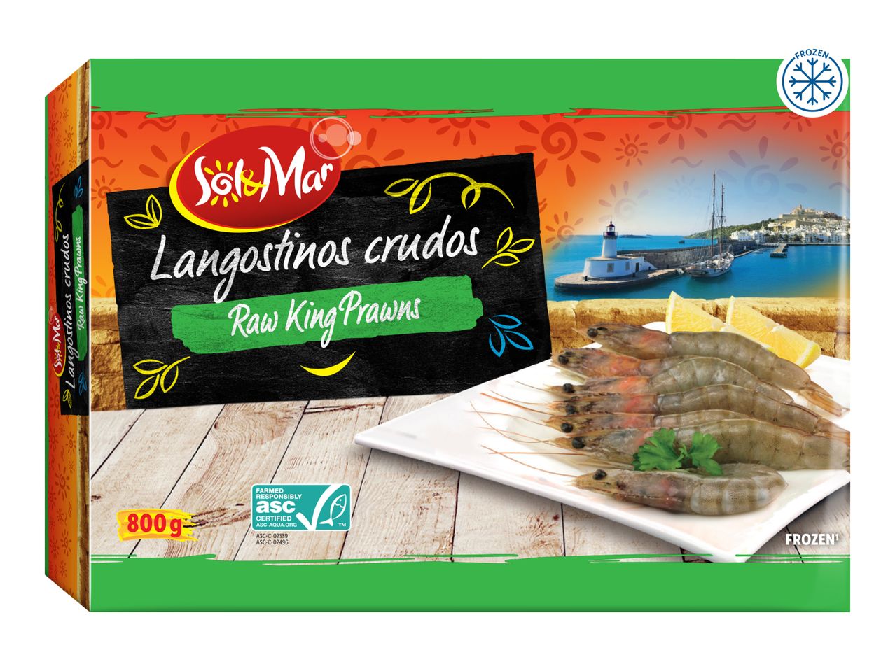 Frozen raw king prawns in a box, with a coastal town and lighthouse in the background.