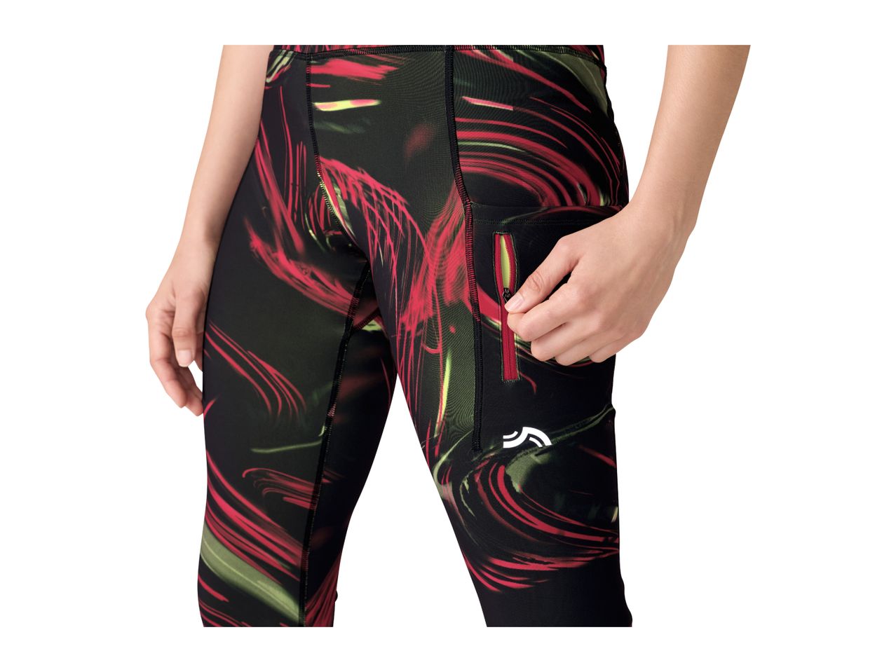 Woman in black, red, and green patterned sports leggings with a zippered pocket.