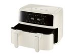 Cream-colored dual-basket air fryer with digital display showing 180°C.