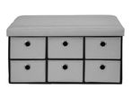 Grey storage ottoman with six fabric drawers and metal ring pulls