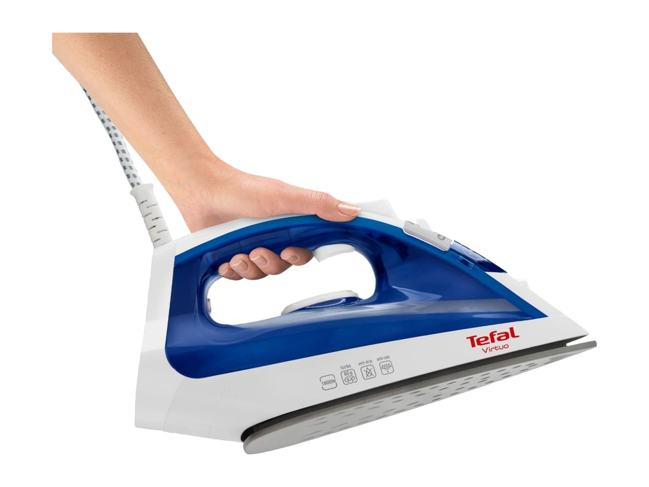 Hand holding a white and blue steam iron with a textured soleplate.