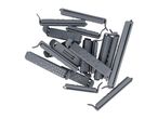 A pile of grey plastic bag clips of various sizes, some with textured surfaces.