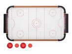 An air hockey table with scoreboards, red lines, and four red pucks below it.