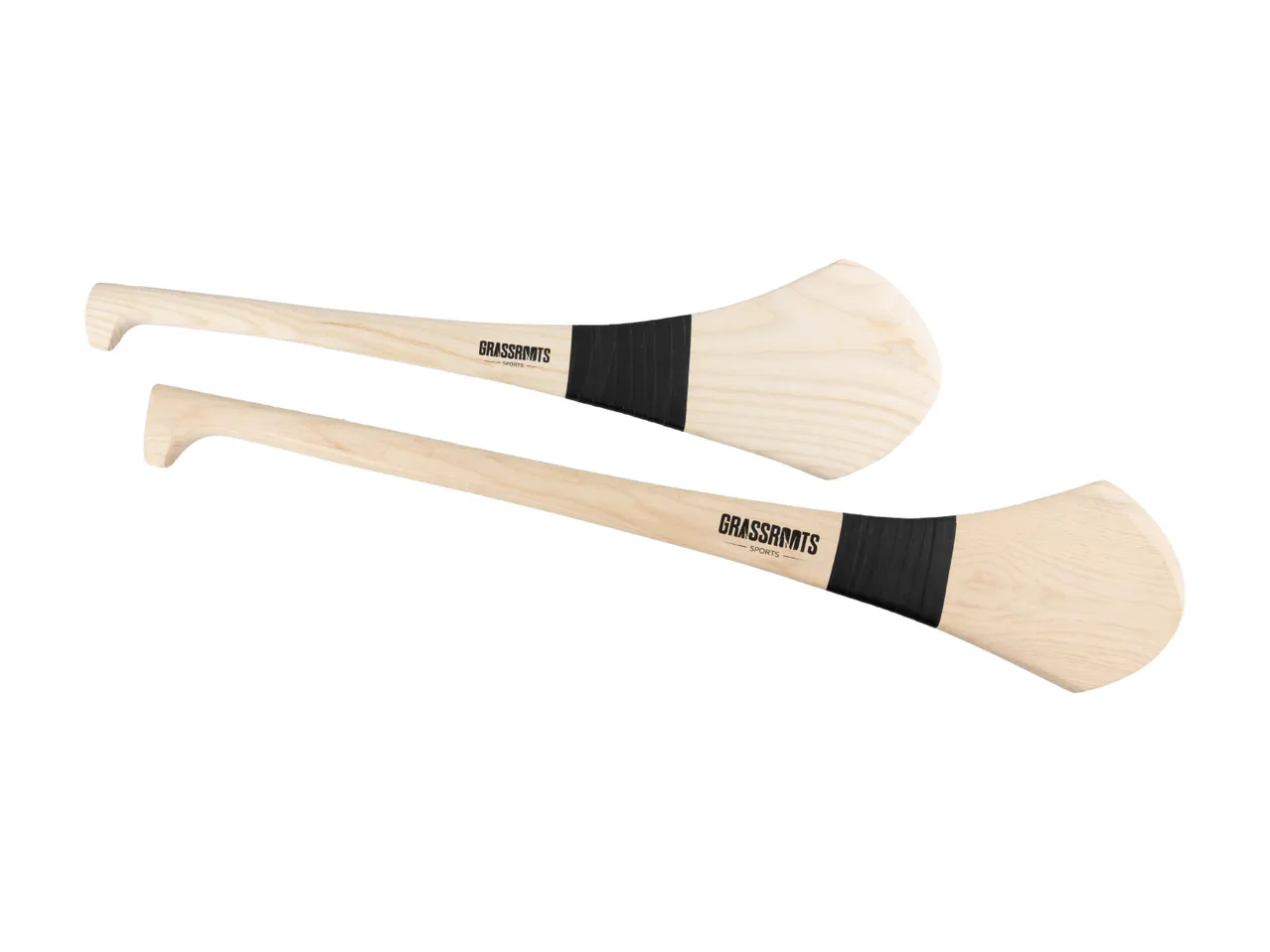 Two wooden hurleys with black grip tape, one slightly above and behind the other.