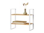 Two-tier bamboo shelf with white metal frame, holding a vase with dried flowers and books.