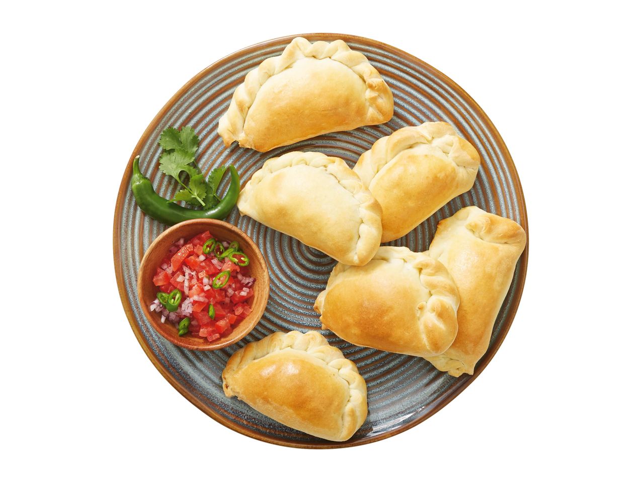 Six golden-brown empanadas served on a plate with salsa.