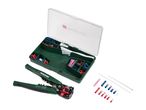 A set of wire strippers, crimping tool, and various electrical connectors in a storage box.