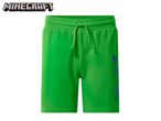 Green shorts with a drawstring waist and blue graphic print on the side.