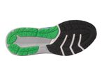 Bottom of a running shoe with green, black, and gray sole patterns.