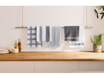 W5 Kitchen Hand Towel & Tea Towel Set in various patterns hanging on a wooden rod.