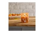 Halloween candle with ghosts and bats on a wooden table with pumpkins
