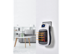 Aquecedor cerâmico de tomada TRONIC® aquecendo uma sala de estar moderna