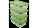 A stack of four transparent plastic food containers with bright green lids.
