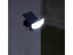 A solar-powered outdoor light illuminating a dark area.