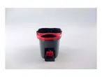 A black and red spin mop bucket with a wringer sits on a white surface.