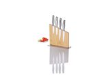 A wooden knife block holds a set of stainless steel kitchen knives.