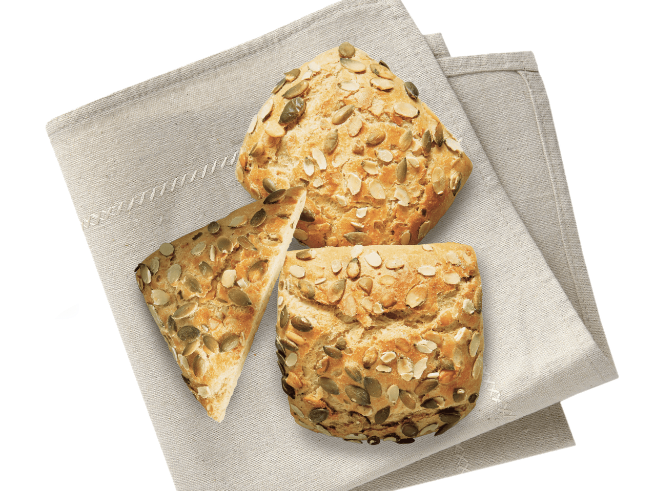 Drei Sesam- und Sonnenblumenkernbrötchen auf einem Serviettenuntersetzer.