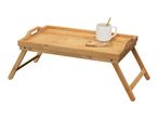 Bamboo bed tray with a white mug and reading glasses.