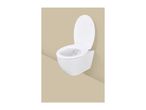 White wall-mounted toilet with the lid open against a beige background.