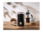 Coffee grinder, French press, and coffee beans on a wooden table.