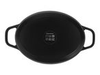 Bottom view of a black oval cast iron casserole dish with handles and cooking compatibility symbols.