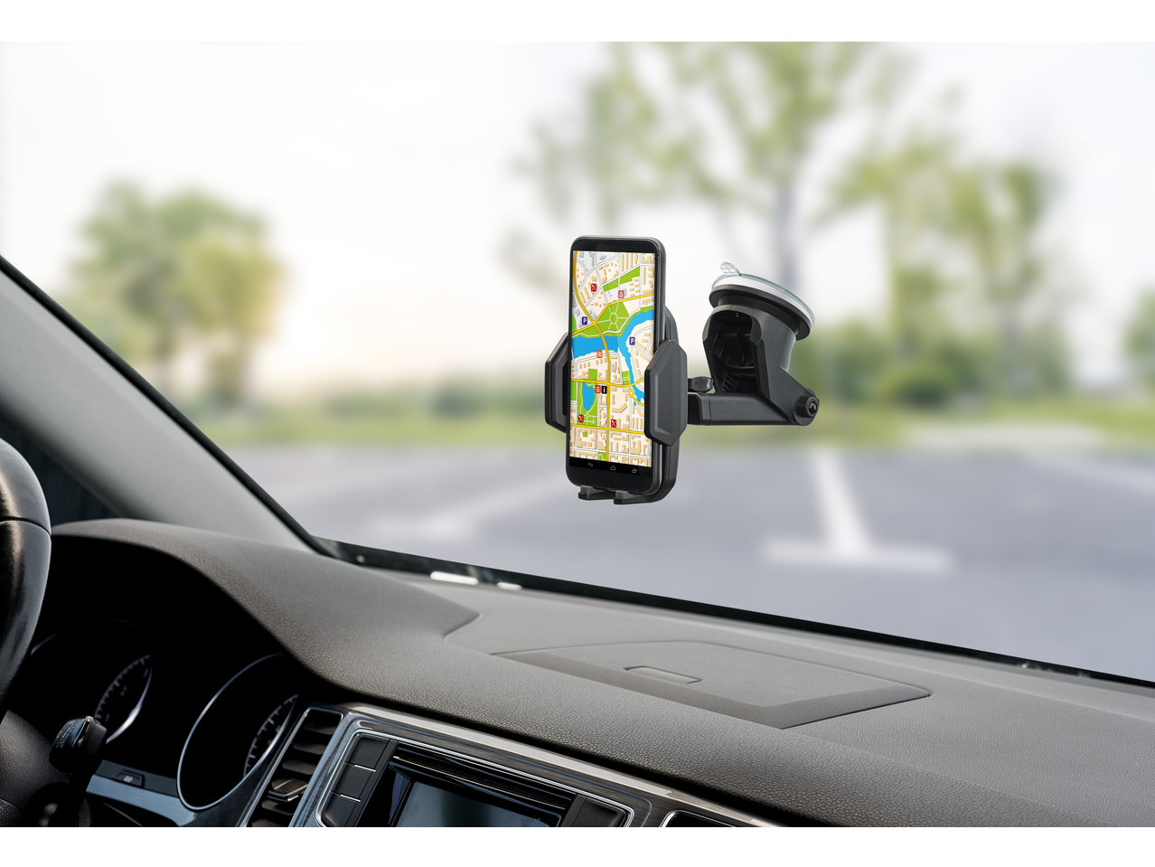 ULTIMATE SPEED® Car Smartphone Holder with a phone displaying a map, mounted on a car windshield.
