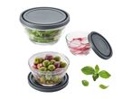 Three glass food storage containers with gray lids, filled with various fruits and vegetables.