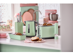 Mint green kitchen appliances: kettle, toaster, knife block, and loaf pan on a counter.