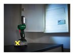 A Parkside X20V Team LED work light illuminating an open electrical panel.