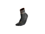 A single black and orange athletic sock with a mountain logo.
