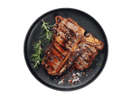 T-bone zrezek z rožmarinom in začimbami na črnem krožniku.