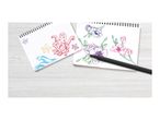 Two sketchbooks with colorful drawings of sea creatures and flowers, with a black pen.