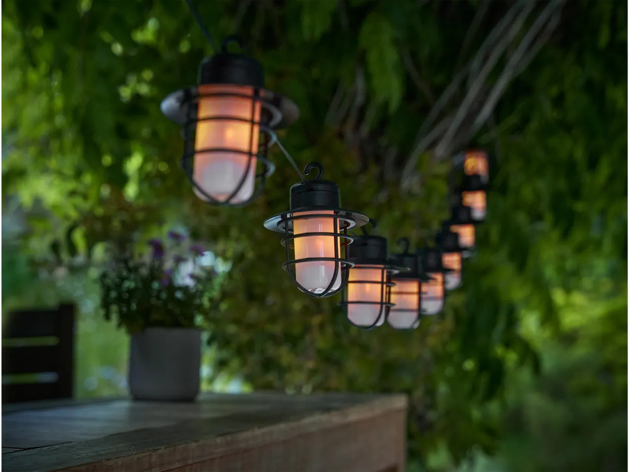 Outdoor string lights with vintage-style lanterns.