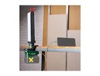 A cordless work light clamped to a table, charging a smartphone.